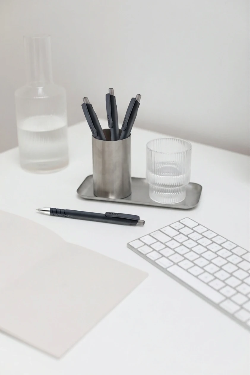 MAXY pens in a desk organiser next to a keyboard